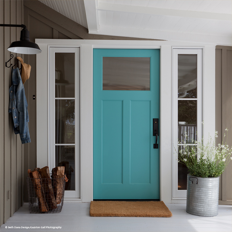 turquoise entry door with large glass panel